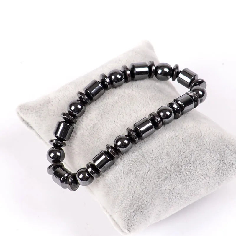 Black stretch bracelet with a pentagram stone, made from magnetite and hematite.