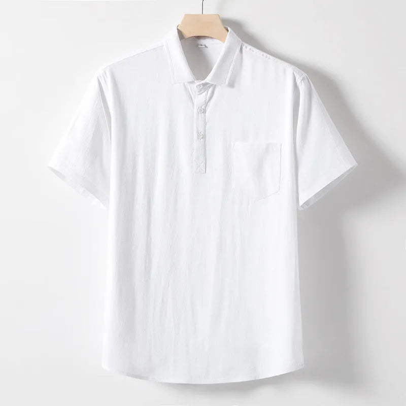 Man modelling a loose-fit linen blend T-shirt in a solid colour.
