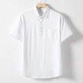 Man modelling a loose-fit linen blend T-shirt in a solid colour.