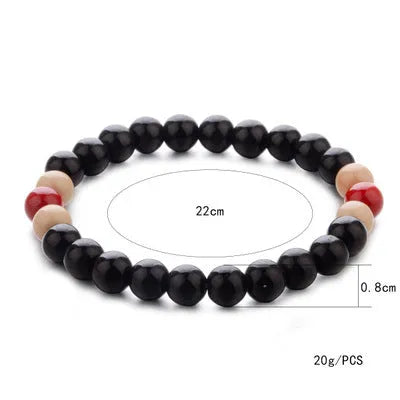 Natural stone bead bracelet with lava stones on a wrist, showing ethnic charm style and adjustable 18cm length.