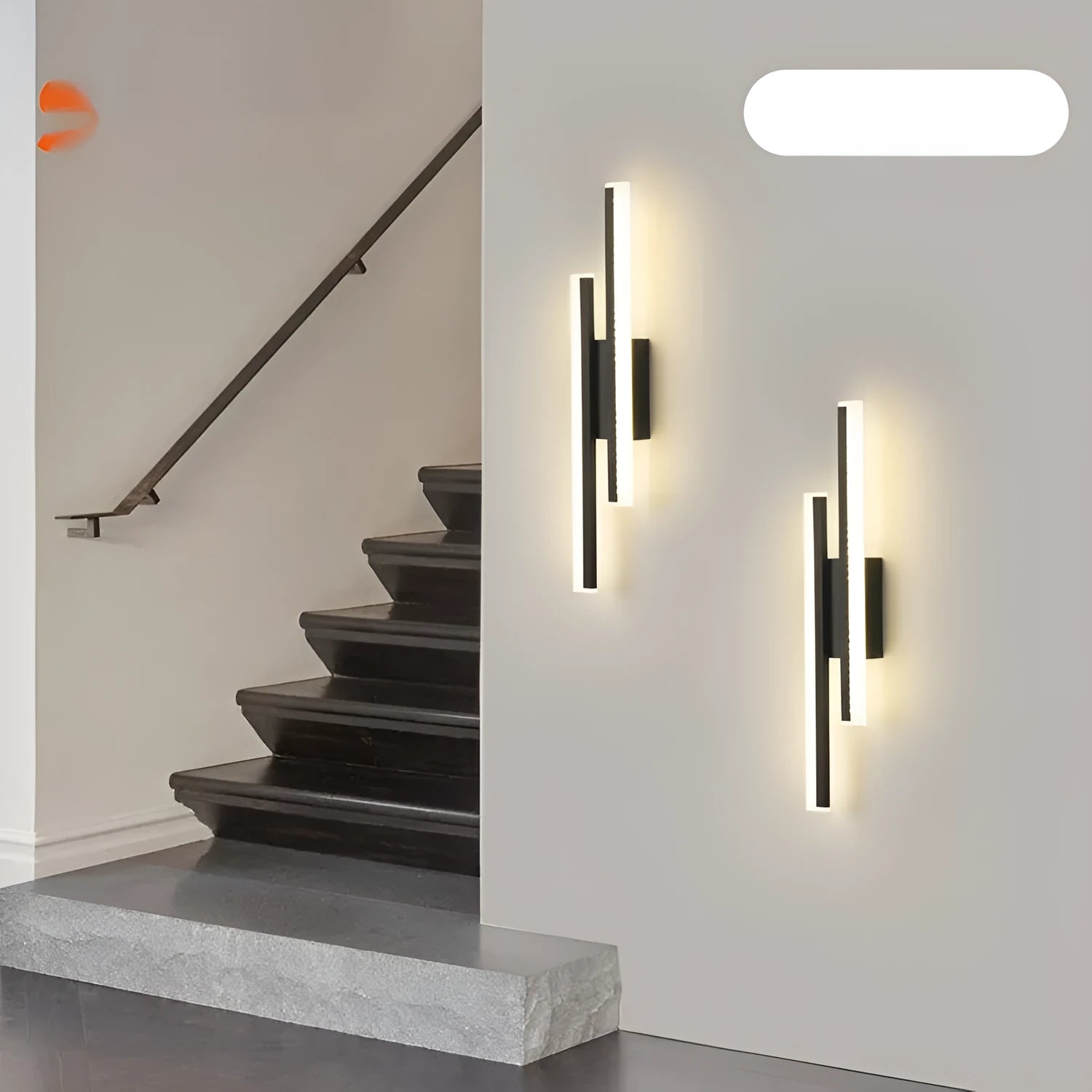 Gold finished double line wall lamp with tri-colour lighting for hotel stairs and modern interiors