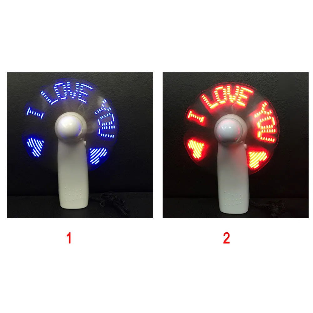 White handheld mini fan with blue and red LED love pattern lights flashing on front