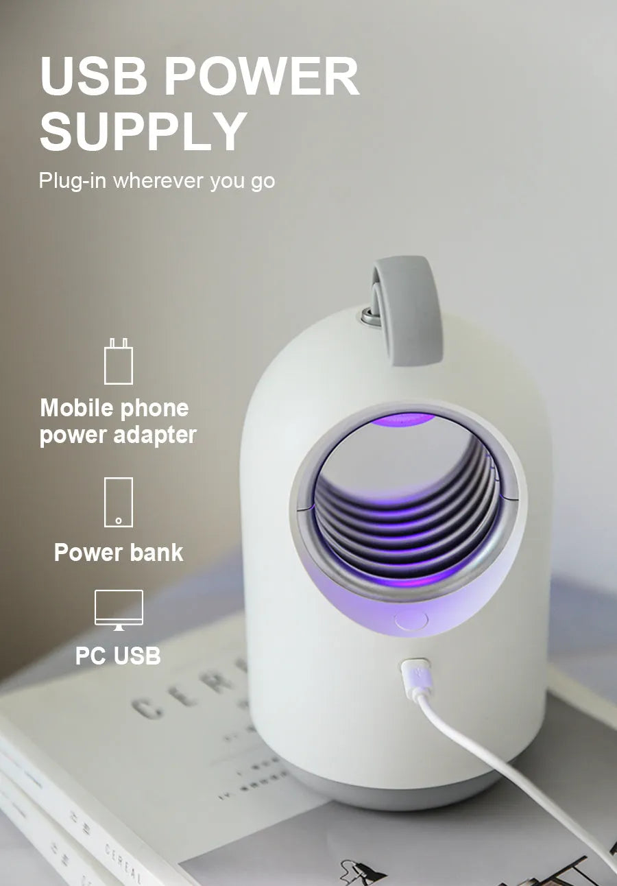 White or blue indoor mosquito killer lamp with UV light, silicone handle, and USB cable.