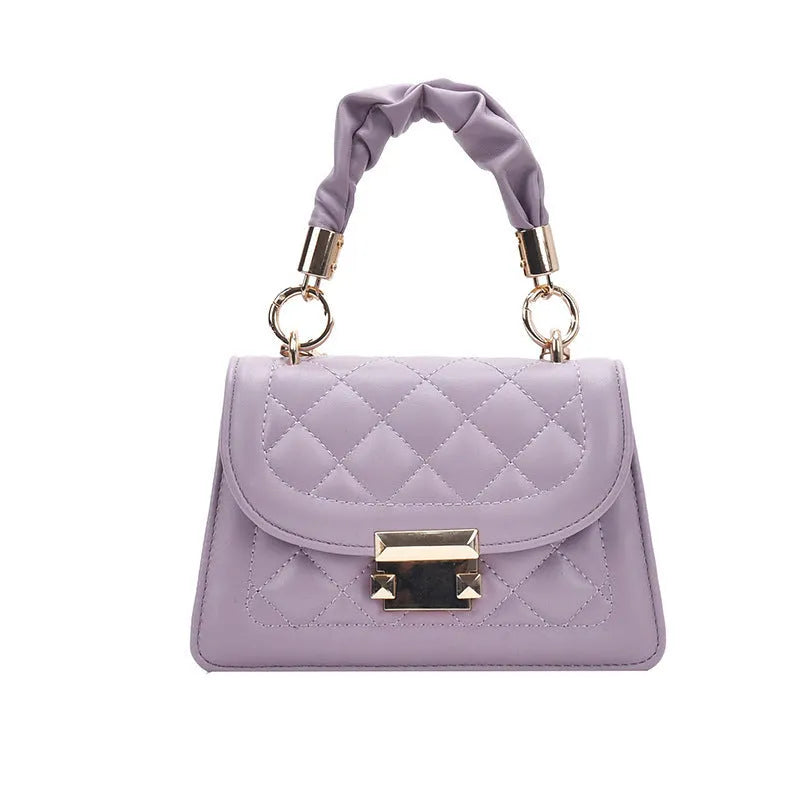 Purple rhombus square women's shoulder bag with crossbody strap on mannequin