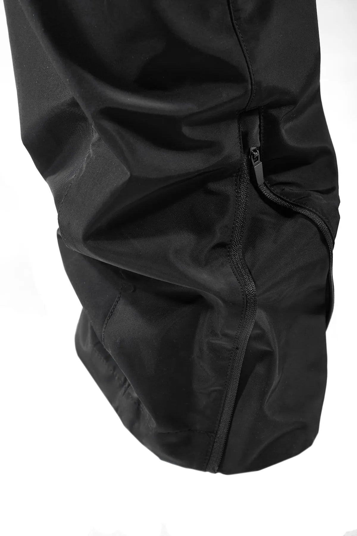 Black waterproof paratrooper trousers with integrated pant straps and 100% polyester fibre construction