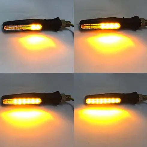 Four universal motorcycle turn signals with flowing water amber LED light, flexible rubber body, black shell, 2.5 x 11cm