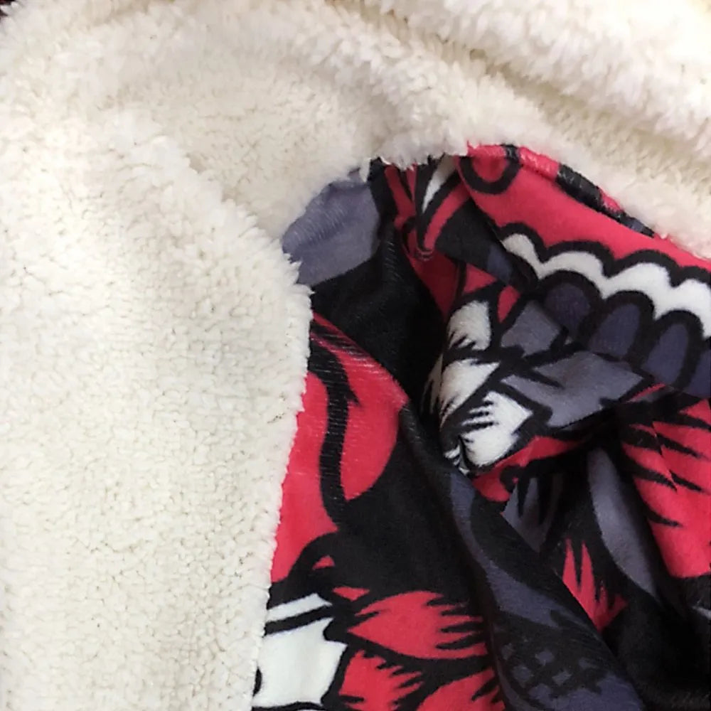 Round coral fleece burrito blanket with printed design on soft flannel fabric.
