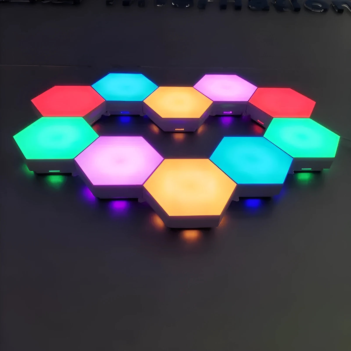 British Creative Helios touch wall lamp with hexagonal modular assembly and plastic shade, 103 by 90 by 30 mm