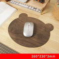 Extra large mouse pad with walnut wood surface and natural rubber base on a desk