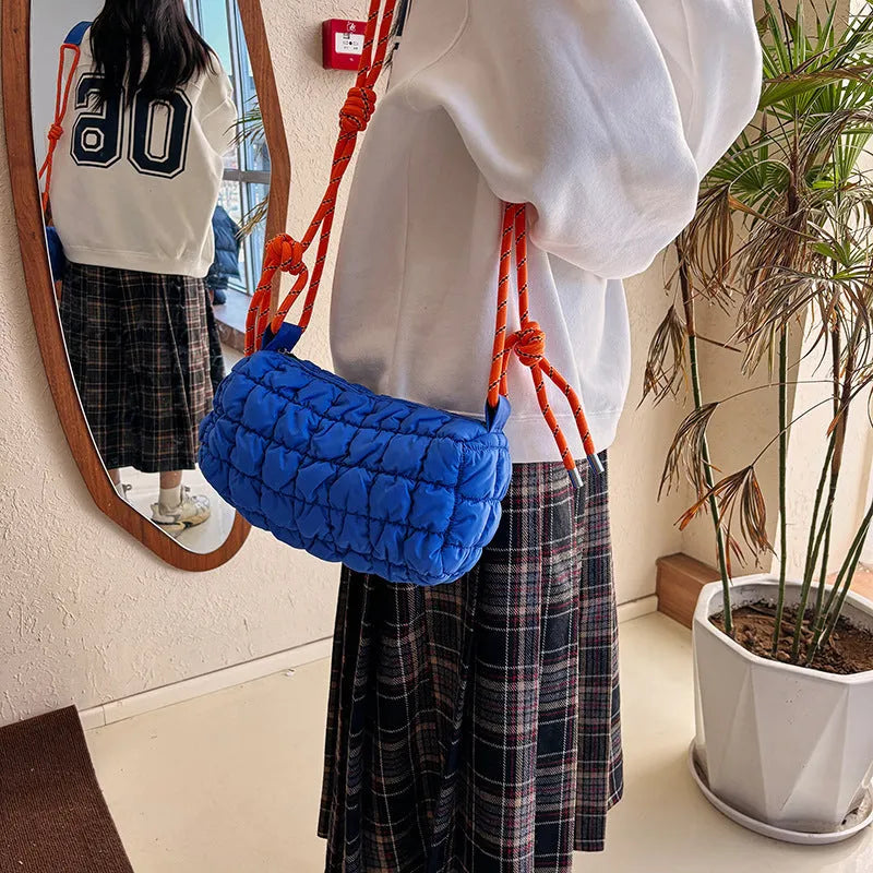 Women's lightweight nylon messenger bag in pillow shape with single shoulder strap