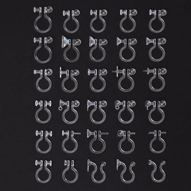 Transparent plastic ear stud converter in U shape on white background
