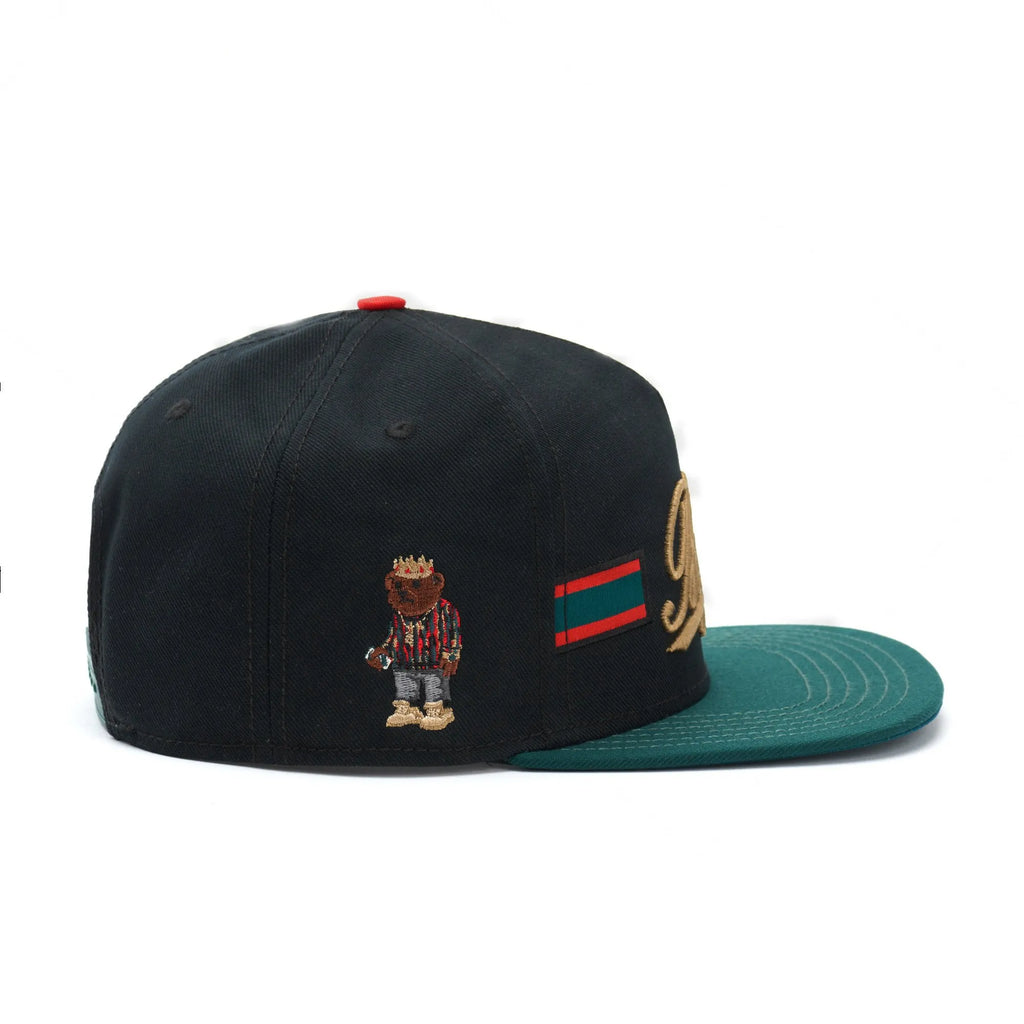 Black canvas embroidered baseball cap with dome shape and adjustable back closure
