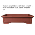Large rectangular purple clay bonsai flowerpot showing its handmade texture and size.