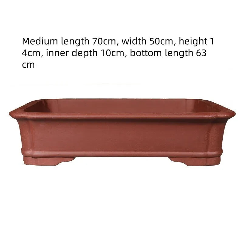 Large rectangular purple clay bonsai flowerpot showing its handmade texture and size.