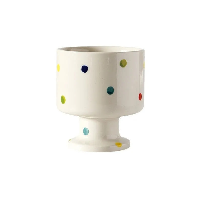 Hand-pinched irregular shaped ceramic mug in a solid colour, showing its unique form.