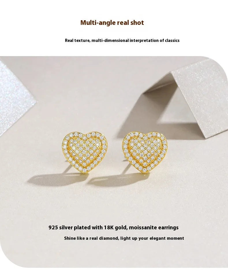 S925 sterling silver heart-shaped stud earrings with golden finish and minimalist design