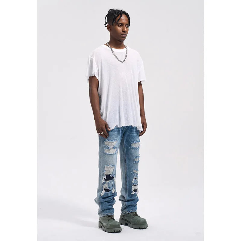 Vintage loose casual jeans for men in wash blue denim with relaxed fit and straight leg design
