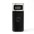 Black portable wireless smart vehicle air pump with hoses and nozzles on a storage bag.