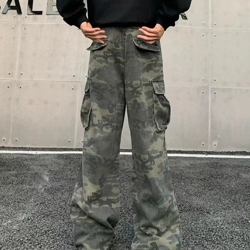 Cotton blend cargo pants in a washed camouflage print with multiple pockets and a mid waist.