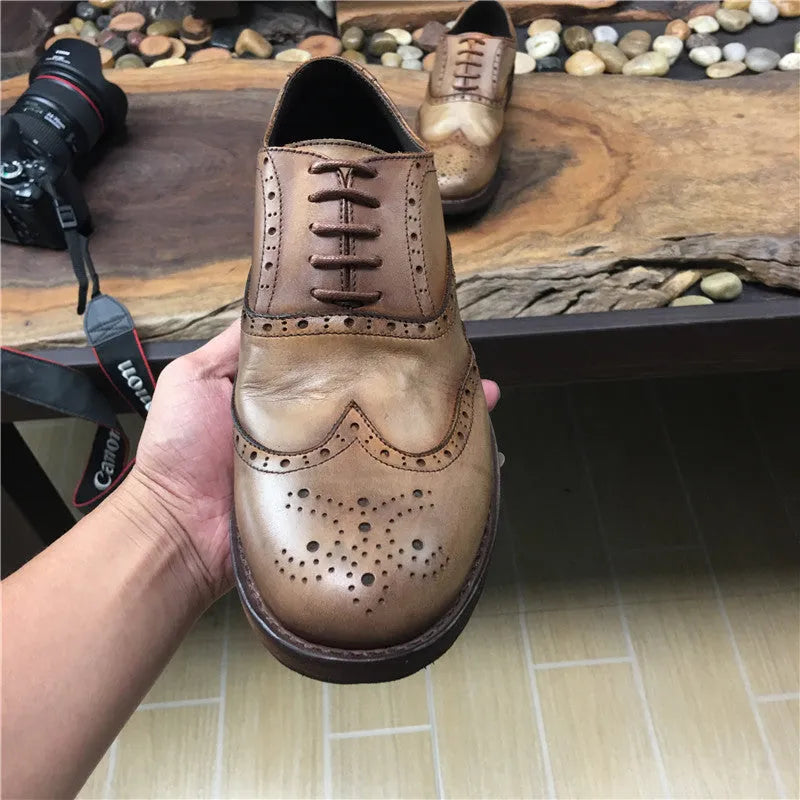 Light brown men's vintage engraved leather lace-up shoes with round toe.