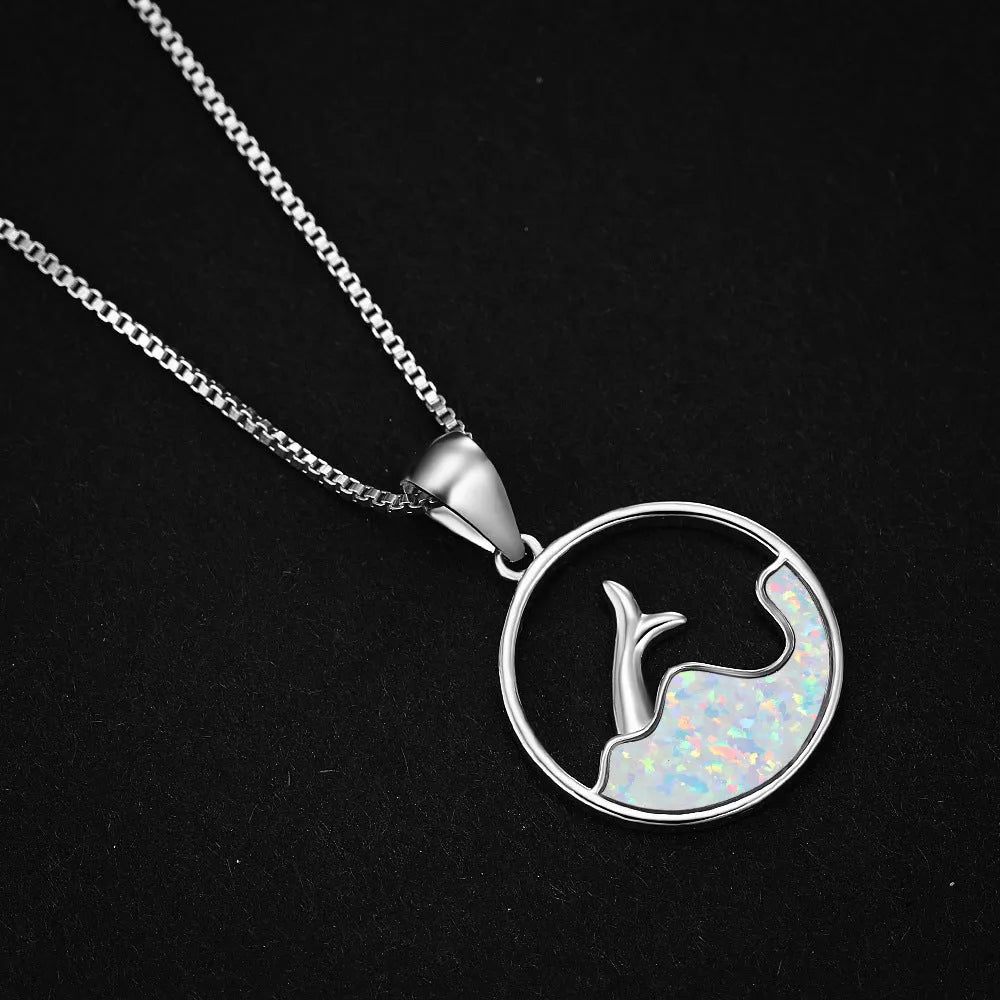 Geometric sea fishtail pendant necklace with an electroplated white gold finish and an opal colour variant.