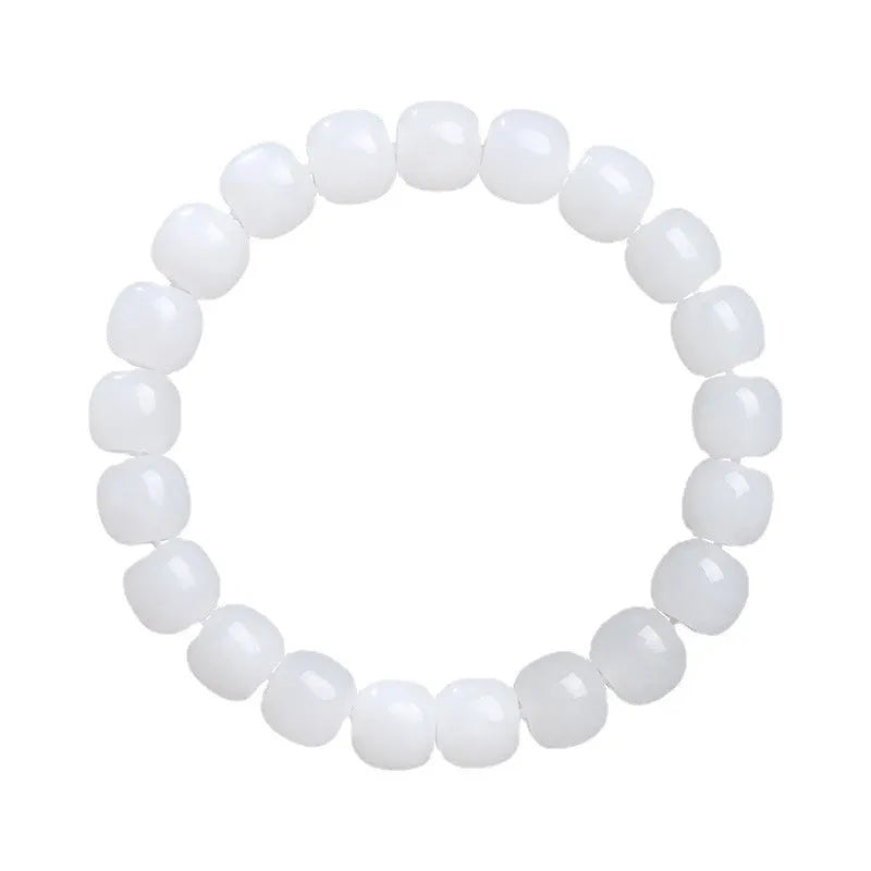 White Hetian jade barrel bead bracelet on a wrist, showing the smooth stone beads and unisex casual design.