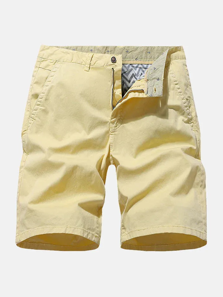 Men's blue printed denim shorts with a loose, casual straight fit on a hanger