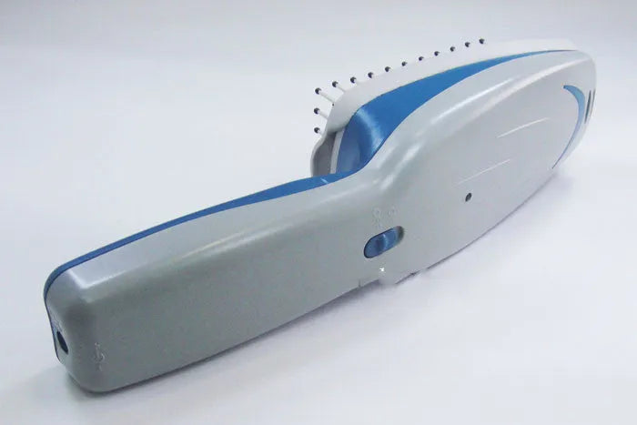 A white pet comb with a removable brush head and a handle housing negative ion and active oxygen technology.