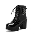 Women's black ankle boot with a thick rubber heel, round toe, and front lace-up closure on a waterproof platform.