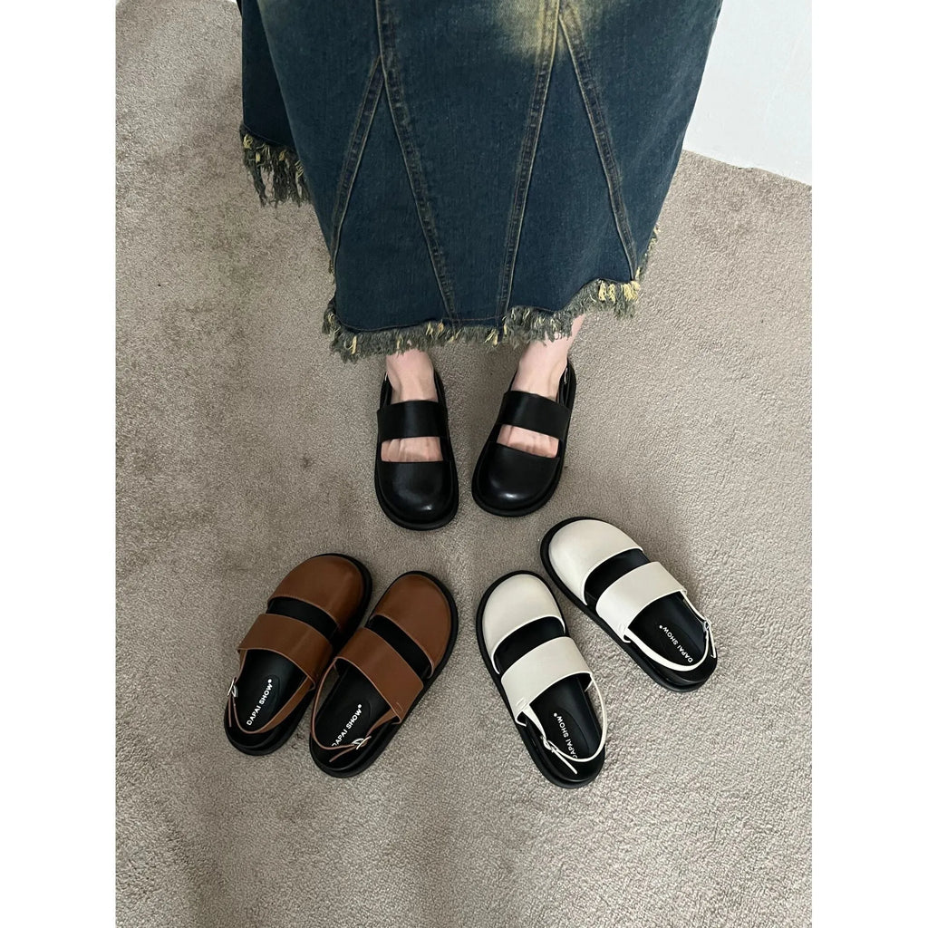 Retro raised sandals with ankle strap buckle in apricot colour showing closed toe design