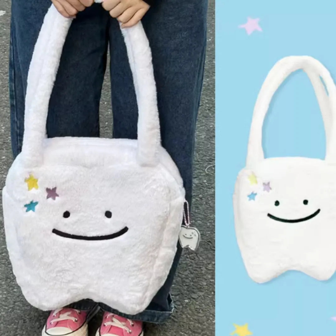 White plush tote bag with cute tooth pattern, zipper closure, and shoulder strap