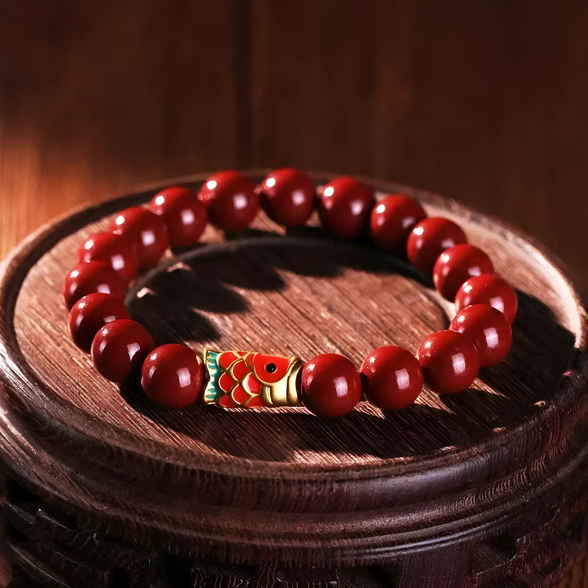 Natural cinnabar koi bracelet with golden ball design in Chinese national style
