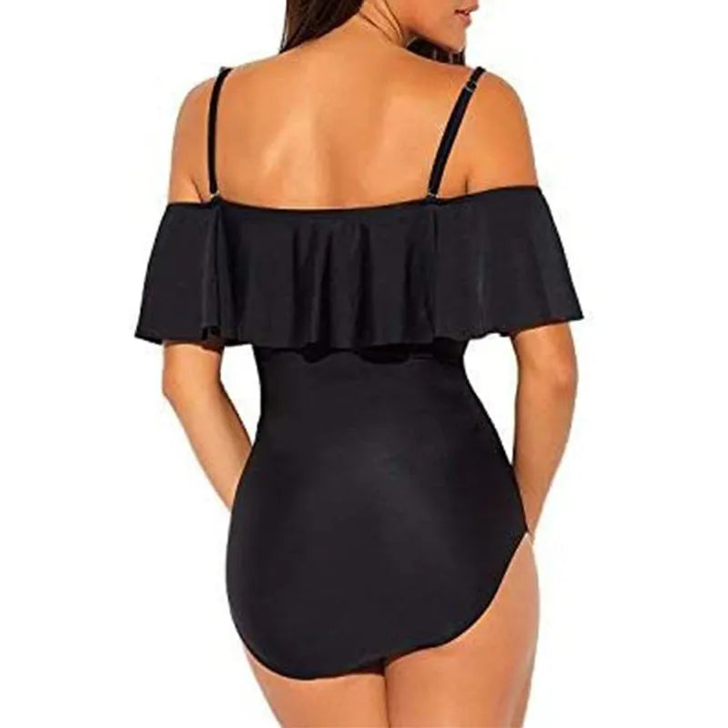 Black one-piece swimsuit with side cut-out detail and ruffled tube top straps.