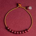 Cinnabar and Hetian jade geometric bracelet with hand-woven construction