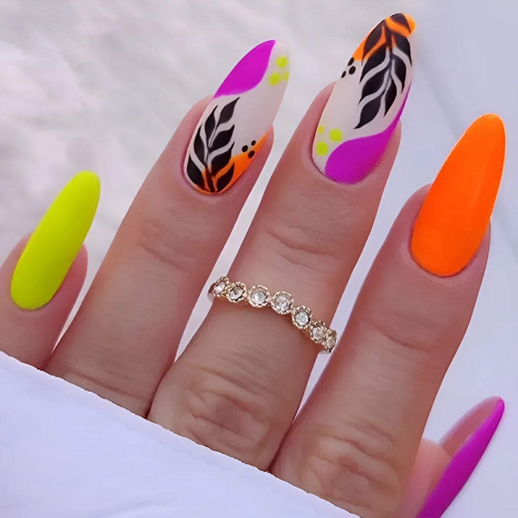 Wear Armour brand medium almond shaped frosted nail sticker set showing four different designs: French colourful leaf, colourful plating, star flash macaron, and gradient leopard print.