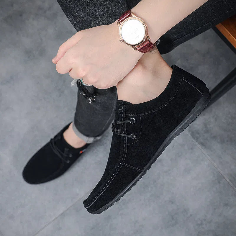 Men's casual slip-on loafers in brown with round toe, stitching, and non-slip plastic outsole