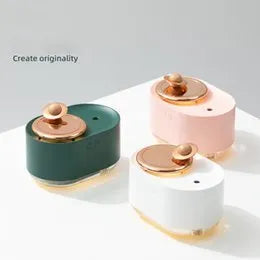 Green rotating planet USB humidifier with night light on wooden surface