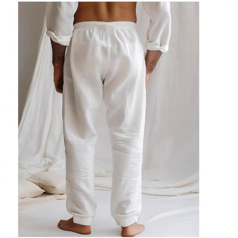 Men's light grey loose-fit summer trousers with a drawstring elastic waist and straight legs.