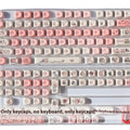 Close-up of a pink pig character artisan key cap for mechanical keyboards with five-sided sublimation printing.