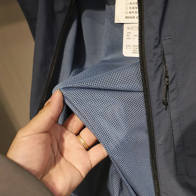 Men's straight-cut nylon vest in army green with side seam pockets, laid flat.