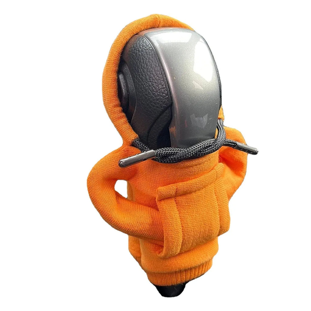 Cloth car gear shift knob cover in various colours showing its 13cm by 8cm size