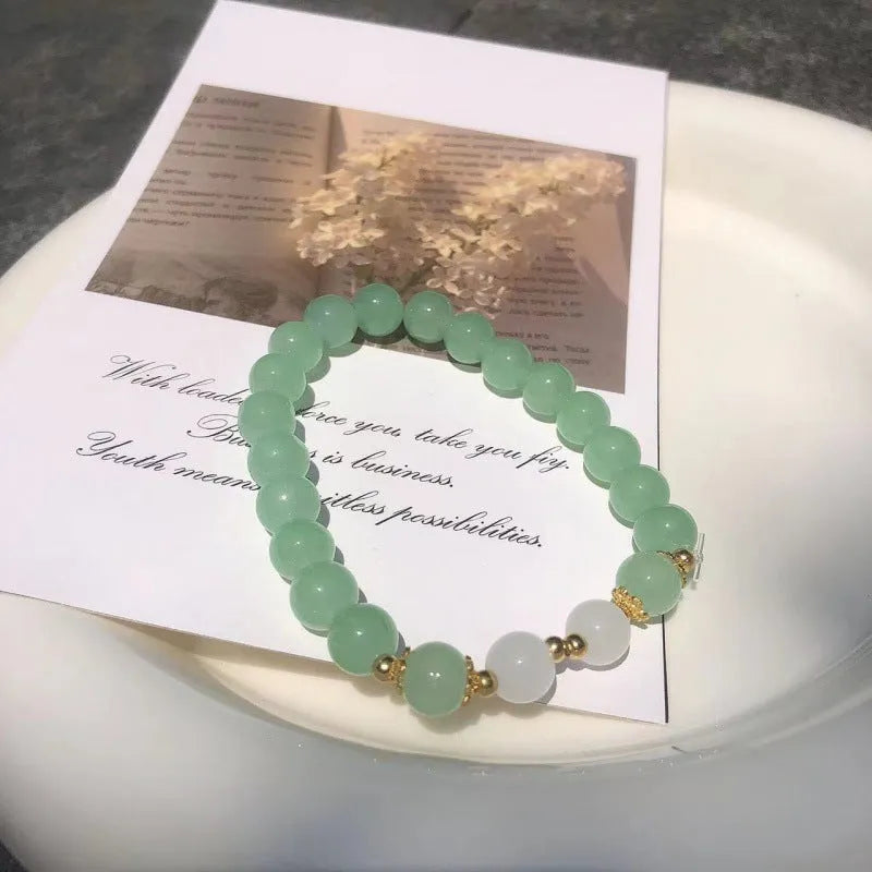 Chinese style glass bamboo leaf bracelet for women with manual craft details.