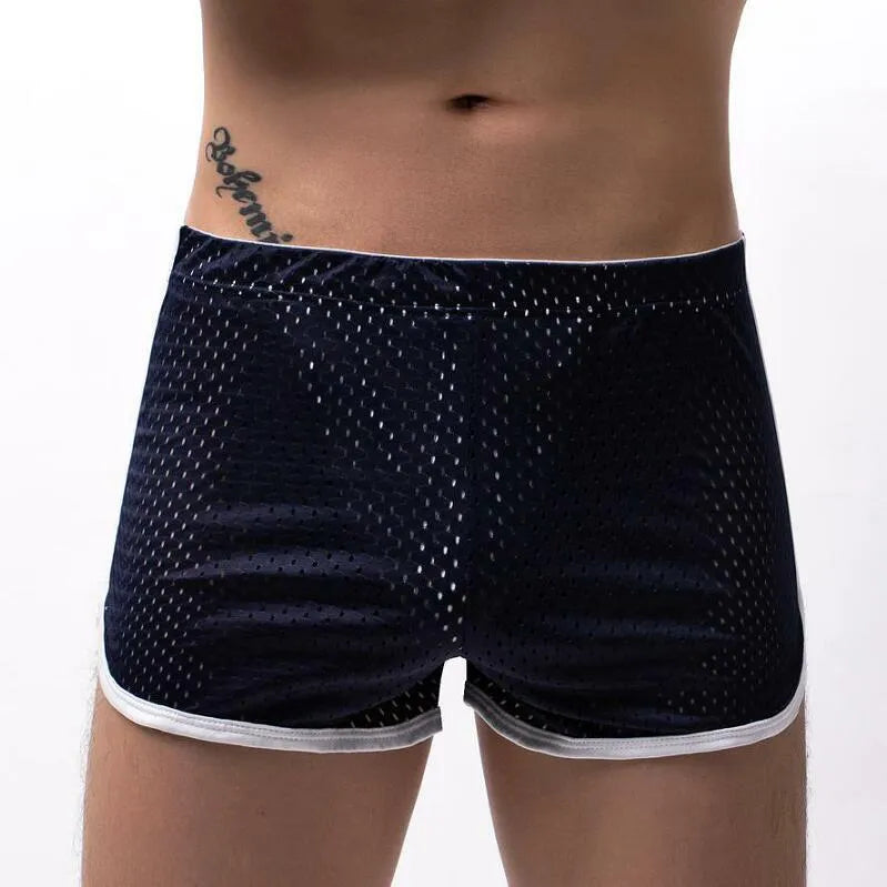 Men's black three-point boxer briefs made from cotton and nylon fabric.