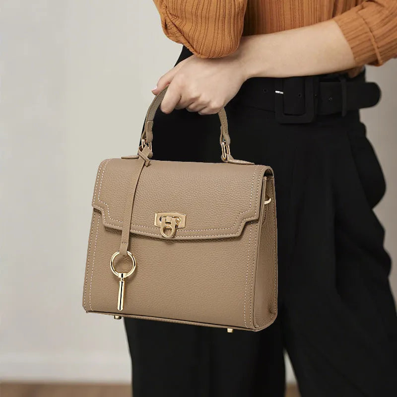 Elephant grey vintage handbag with litchi pattern texture and lock detail