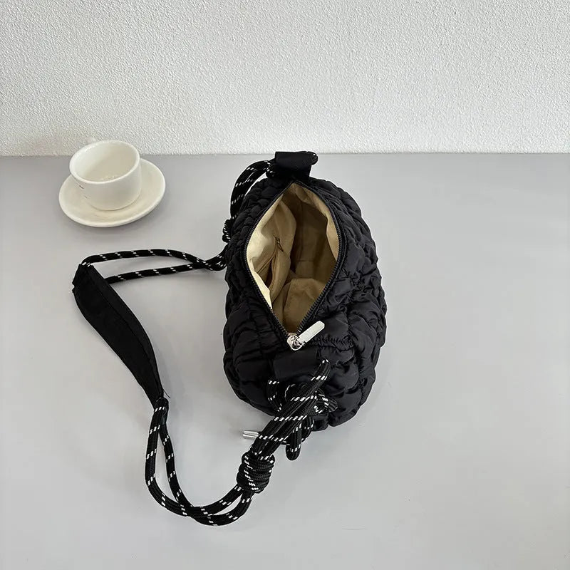 Women's lightweight nylon messenger bag in pillow shape with single shoulder strap