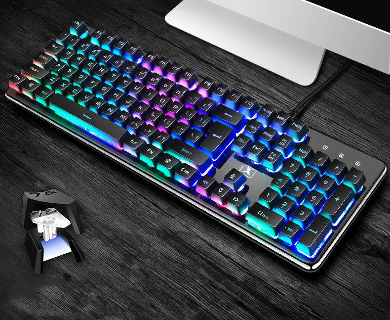 Black three-piece Steampunk Manipulator wired gaming keyboard, mouse and headset set on a desk