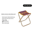 Black ethnic style aluminium alloy folding stool in open position for outdoor seating