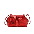Simple hair clip shoulder crossbody bag in shell shape, showing rose red colour with visible sewing lines.