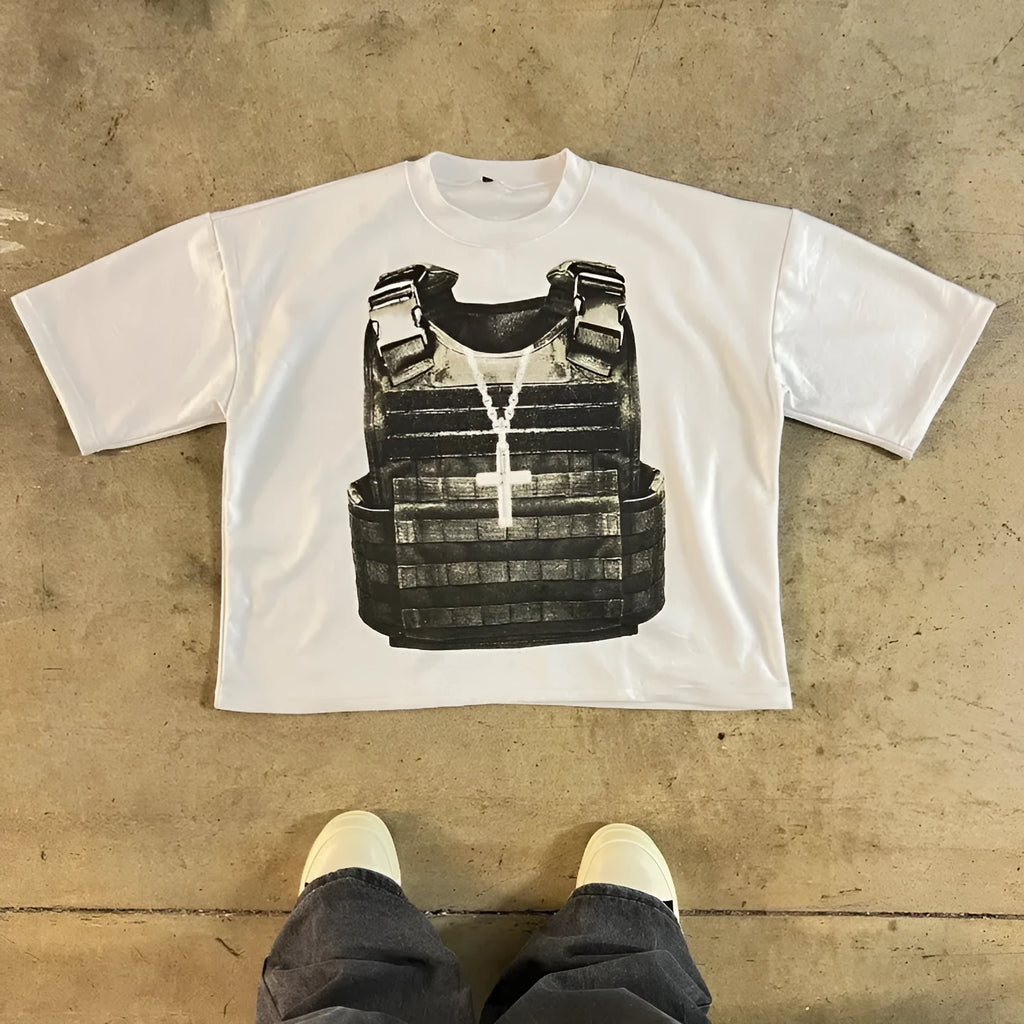 Man wearing a printed retro style cotton t-shirt with drop shoulder sleeves in a graphic design.