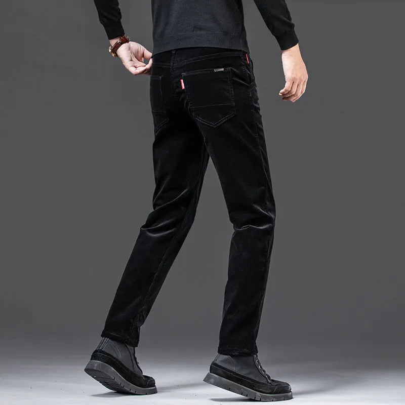Straight slim-fit cotton corduroy trousers in black, side view, mid-waist, zip-placket fly